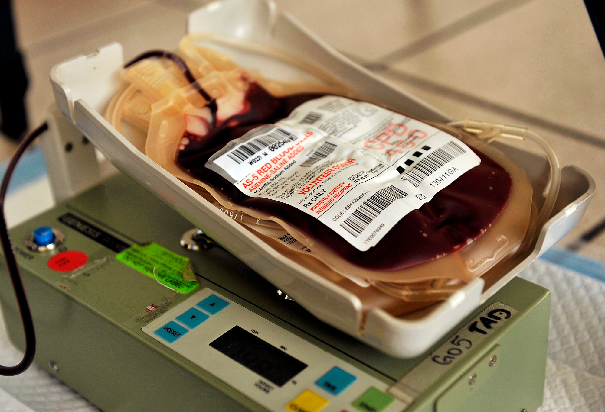 Blood is drawn from a donor during a blood drive at the Exchange on Kadena Air Base, Japan, Nov. 13, 2014. Seventeen donors participated in this blood drive, and the 18th Communications Squadron plans to host a blood drive every four months to help support the Armed Services Blood Program. Blood donated at this event is to be used exclusively for U.S. military personnel. (U.S. Air Force photo by Naoto Anazawa/Released)