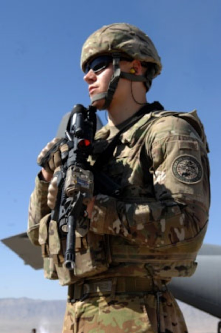Senior Airman Andrew Beer secures the landing area around a C-130 Hercules while serving as a Fly-away Security Team member in Southwest Asia, Nov. 2, 2013. Courtesy photo