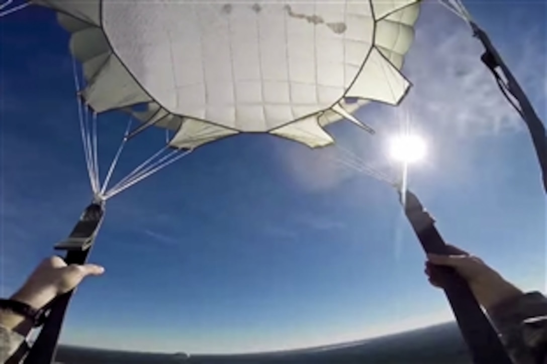 Army Pfc. Tyler Billings offers a firsthand view from his jump during training on Fort Bragg, N.C., Nov. 3, 2014.  The soldiers are assigned to the 82nd Airborne Division.