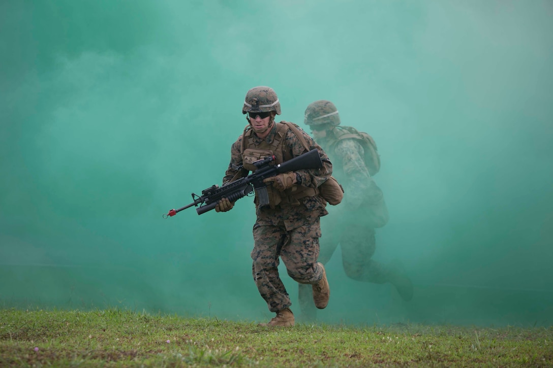 U.S. Marines use smoke as concealment during a training exercise as part of Cooperation Afloat Readiness and Training 2014 Nov. 12 at the Penanjong Garrison, Tutong, Brunei. The smokescreen was one of the techniques U.S. Marines and members of the Royal Brunei Land Force used as they trained in military operations in urban terrain tactics.  CARAT is a nine-country, bilateral exercise series between the U.S., Bangladesh, Brunei, Cambodia, Indonesia, Malaysia, Singapore, the Philippines, Thailand and Timor-Leste. The U.S. Marines are with 2nd Battalion, 9th Marine Regiment currently assigned to 4th Marine Regiment, 3rd Marine Division, III Marine Expeditionary Force under the unit deployment program. 