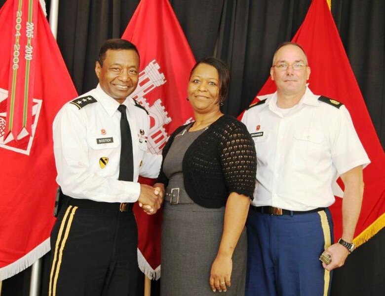 Lt. Gen. Thomas P. Bostick (left) and Command Sgt. Maj. Karl J. Groninger (right) recognizing Ms. Wiseman-Bell at the USACE Summer Leaders Conference.