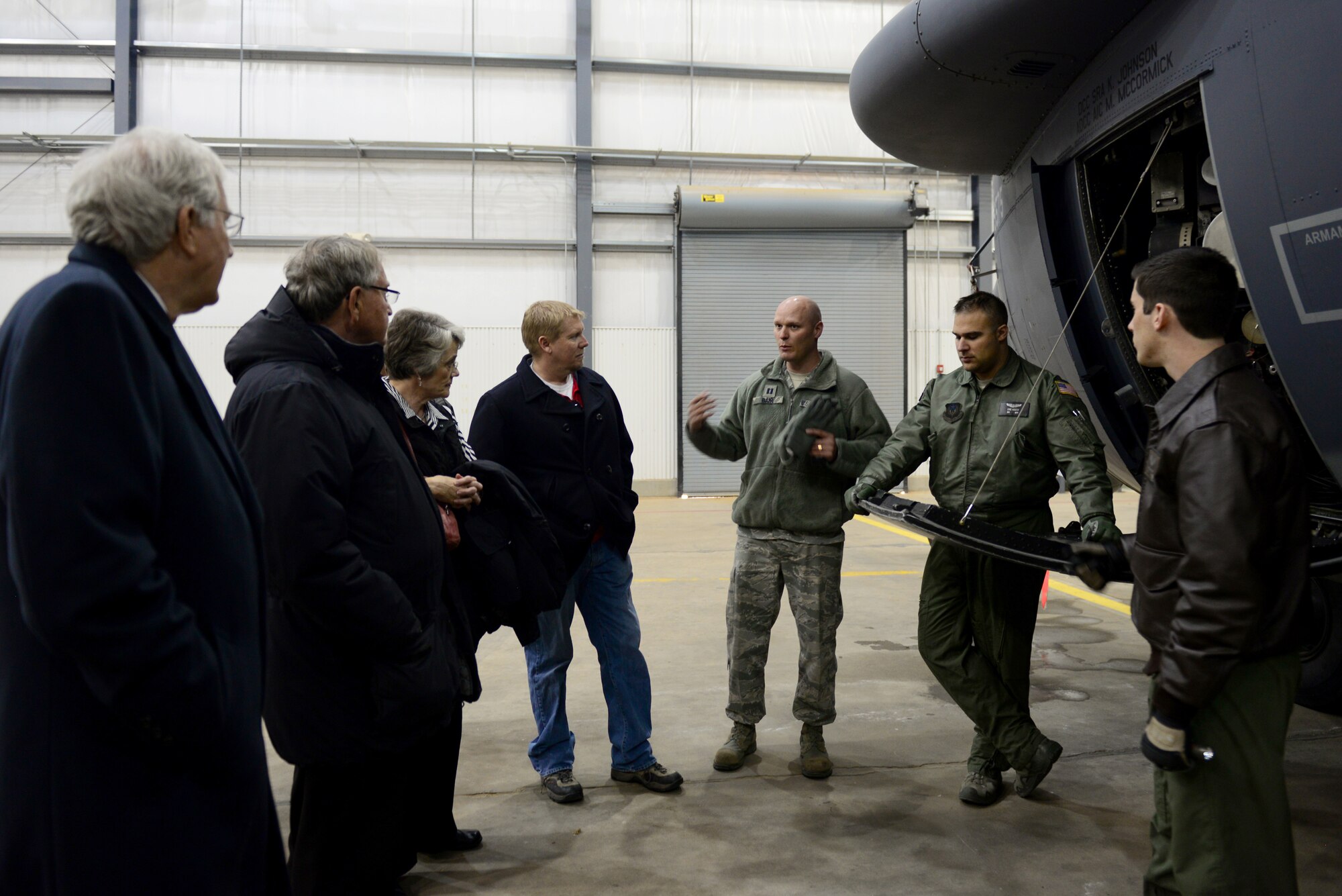 U.S. Air Force aircrew members with the 16th Special Operations Squadron describe the unique capabilities of the AC-130H Spectre gunship to honorary commanders Nov. 13, 2014 at Cannon Air Force Base, N.M. The 27th Special Operations Wing honorary command program is geared toward fostering military pride and local support from a broad group of surrounding community ambassadors. (U.S. Air Force photo/Airman 1st Class Shelby Kay-Fantozzi)