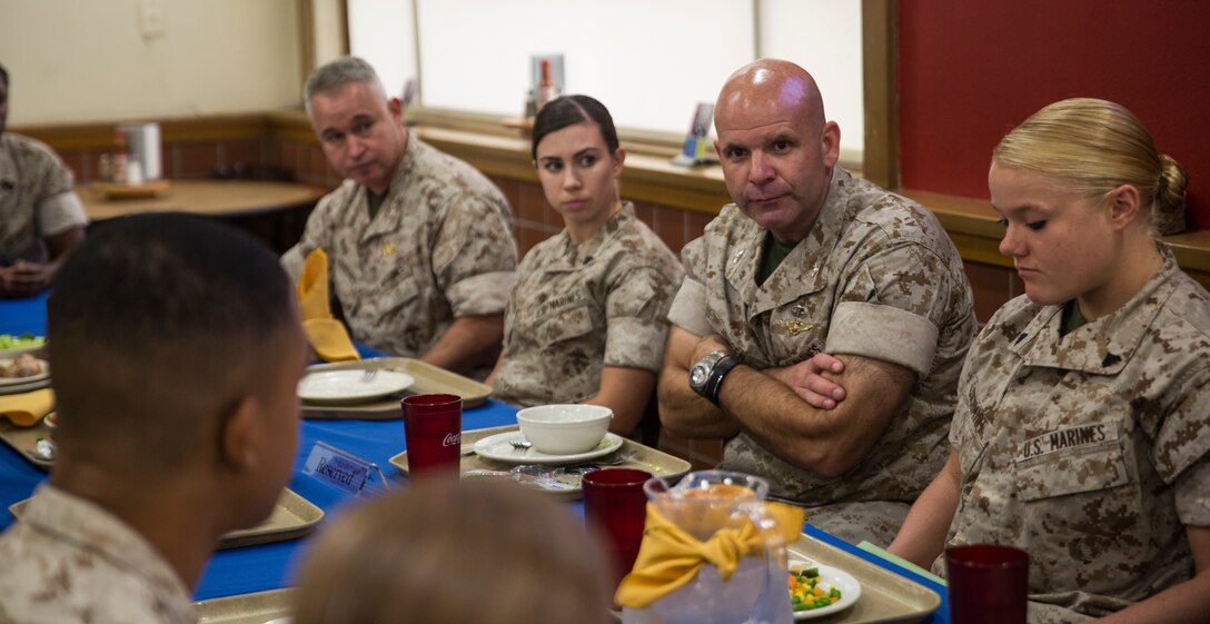 Colonel Scott Jensen, the Sexual Assault Prevention and Response branch head for Headquarters Marine Corps, converses with junior Marines and sailors at the mess hall aboard Marine Corps Air Station Yuma, Ariz., Tuesday. Jensen’s visit follows the release of a video by Headquarters Marine Corps on July 25, in which he announced he would be touring Marine Corps installations worldwide to gain perspective on the SAPR program.
