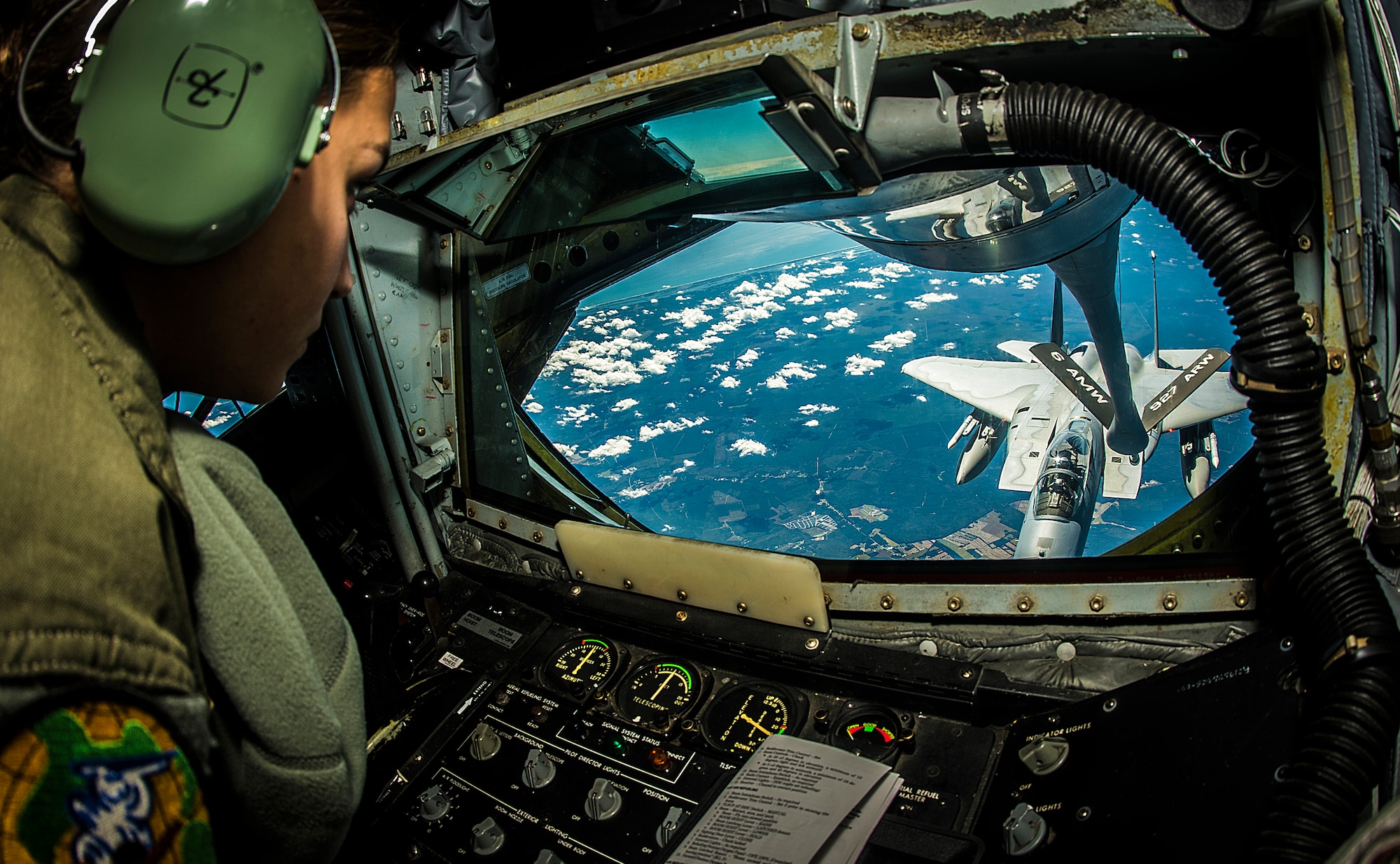 Senior Airman Crystal Cash refuels a 125th Fighter Wing F-15 Eagle on the way to exercise Vigilant Shield 15, Oct. 20, 2014, near MacDill Air Force Base, Fla. The field training exercise is a bi-national NORAD Command exercise that provides realistic training and practice for American and Canadian forces in support of respective national strategy for North America’s defense. Cash is a 91st Air Refueling Squadron boom operator. (U.S. Air Force photo/Tech. Sgt. Brandon Shapiro)