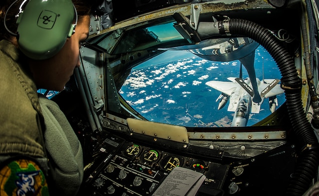 Senior Airman Crystal Cash refuels a 125th Fighter Wing F-15 Eagle on the way to exercise Vigilant Shield 15, Oct. 20, 2014, near MacDill Air Force Base, Fla. The field training exercise is a bi-national NORAD Command exercise that provides realistic training and practice for American and Canadian forces in support of respective national strategy for North America’s defense. Cash is a 91st Air Refueling Squadron boom operator. (U.S. Air Force photo/Tech. Sgt. Brandon Shapiro)