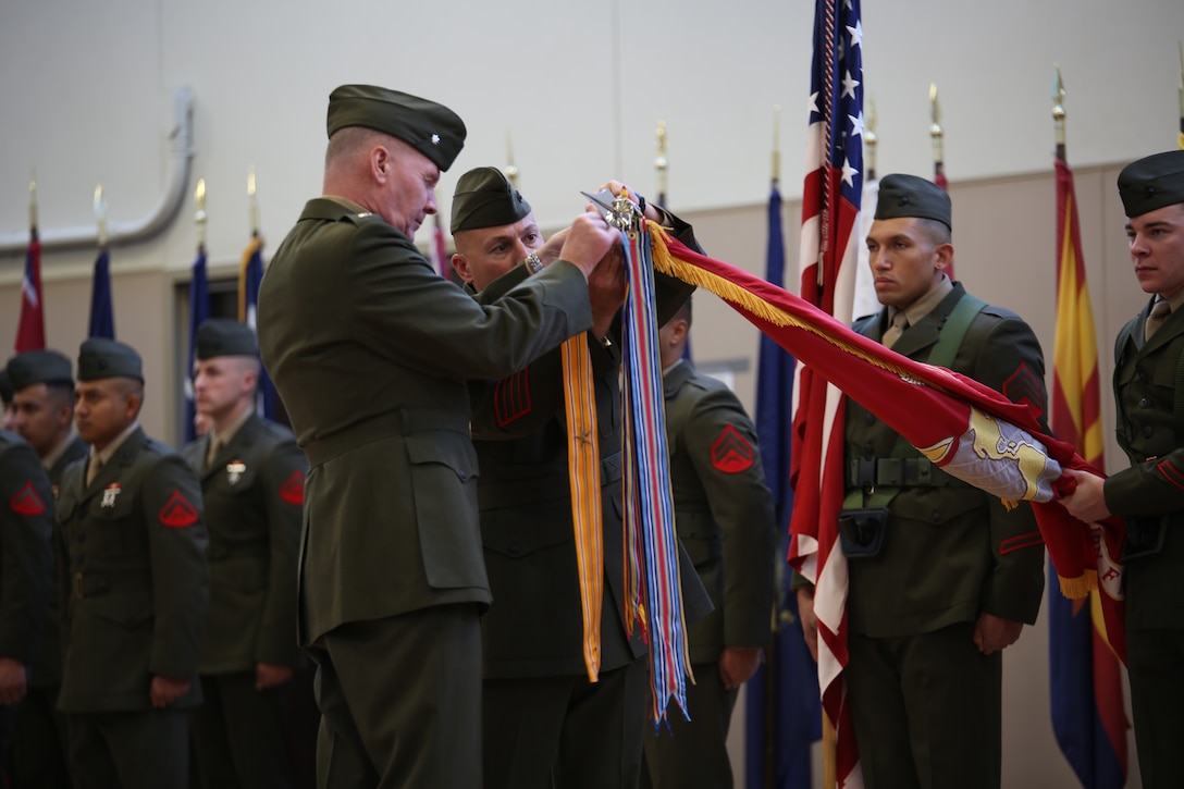Lt. Col. Charles R. Donnelly, commanding officer of 6th Engineer Support Battalion, and Sgt. Maj. Billy Kruthers, 6th ESB sergeant major, attach battle streamers to the unit colors during the battalion’s battle color rededication ceremony in Portland, Ore., Nov. 15, 2014.The battalion celebrated the 70th anniversary of its formation with a rededication ceremony and paid homage to the battalion’s first adjutant, retired Col. James “Rip” Harper. Harper served as the unit’s first adjutant as a first lieutenant in 1944, when the unit was formed in Guadalcanal during World War II. (U.S. Marine Corps photo by Cpl. Tiffany Edwards)
