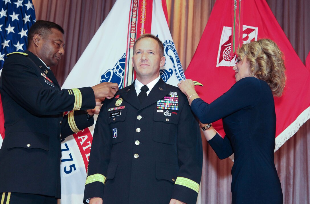 (Then) Col. Jeffrey L. Milhorn, commander, U.S. Army Corps of Engineers-Pacific Ocean Division, is pinned with his first star at a frocking ceremony, Oct. 30, by Lt. Gen. Thomas Bostick, USACE commander and 53rd Chief of Engineers, and his wife, Debbie, at USACE headquarters. The Army Corps’ newest brigadier general is responsible for executing the USACE mission throughout the Indo-Asia-Pacific region. 