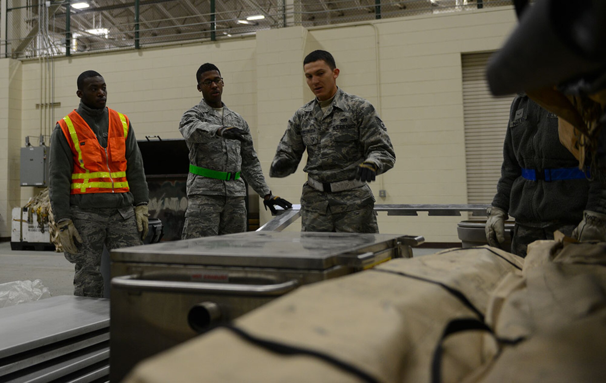 Airmen work together to properly stack pallets to be shipped out as part of Polar Force 14-9 at the Joint Mobility Command on Joint Base Elmendorf-Richardson November 5. .   Polar Force 14-9 is part two of a base-wide exercise to gauge unit readiness. (Air Force Photo by Airman 1st Class Kyle Johnson)
