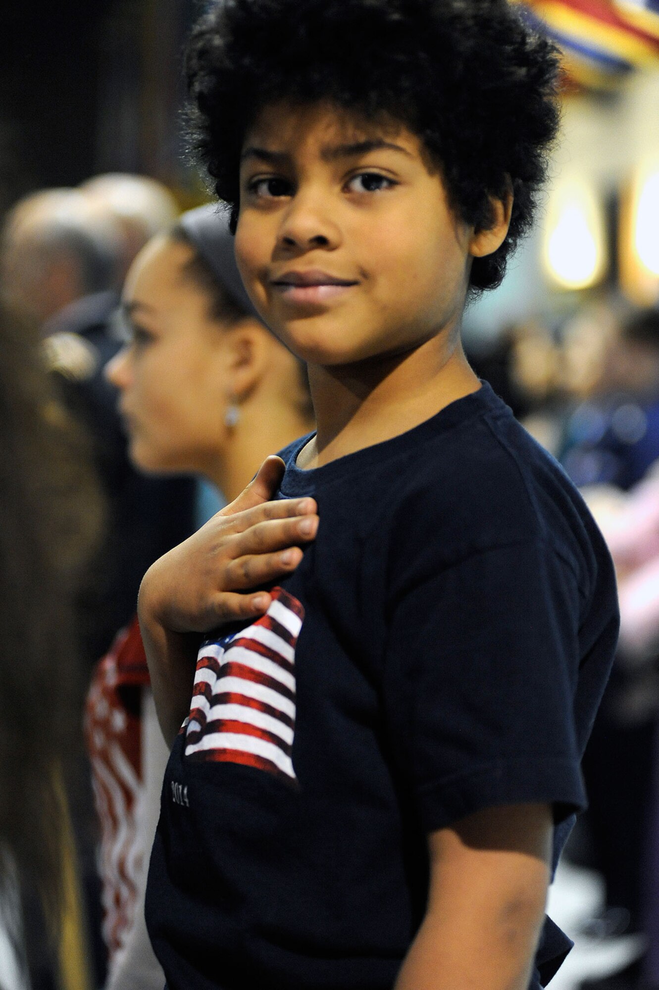 Gregory Vanison, age 6, renders honors for the national anthem during a Veterans Day ceremony at the Alaska Army National Guard armory on Joint Base Elmendorf-Richardson, Alaska, Nov. 11. Vanison is the son of AKARNG Capt. Gregory Vanison, Joint Force Headquarters judge advocate, and a native of the District of Columbia. (U.S. Air Force photo/Staff Sgt. Robert Barnett)