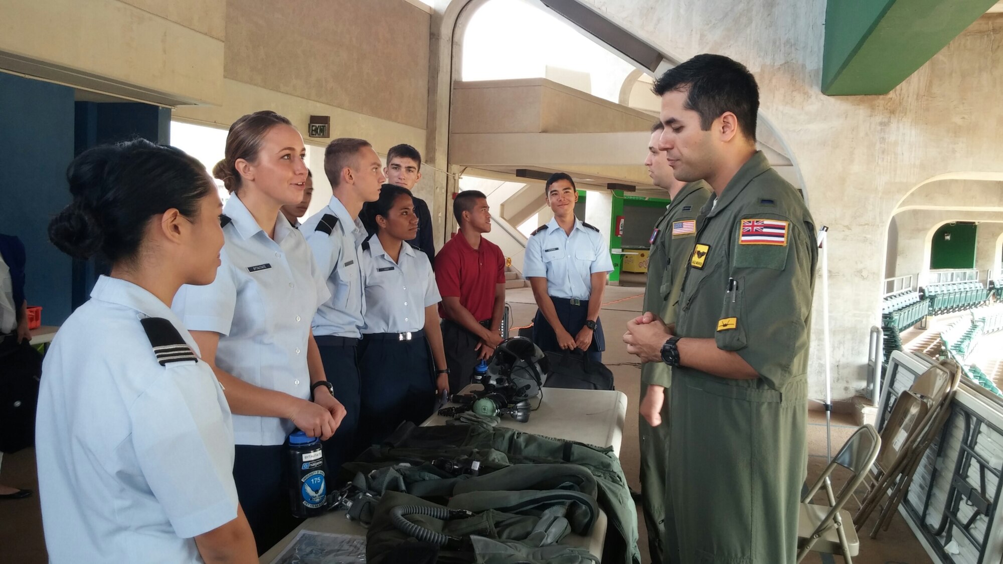 Air Force pilots from Joint Base Pearl Harbor-Hickam, Hawaii, talk to Air Force Reserve Officer Training Corps Detachment 175 cadets about aircrew flight equipment during a career day at the University of Hawaii Nov. 13, 2014. About 80 UH students attended the Leadership Laboratory, which provided the prospective new officers insight into the various Air Force Specialty Codes available. (U.S. Air Force photo by 1st Lt. Andrea Dykes/RELEASED)