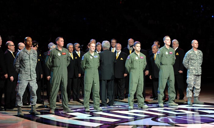 Airmen from Travis Air Force Base, Calif., are honored at halftime during the Sacramento Kings Military Appreciation Night at the Sleep Train Arena in Sacramento, Calif., Nov. 15, 2014. The Airmen recently returned home from overseas operations. (U.S. Air Force photo by Staff Sgt. Robert M. Trujillo/Released)