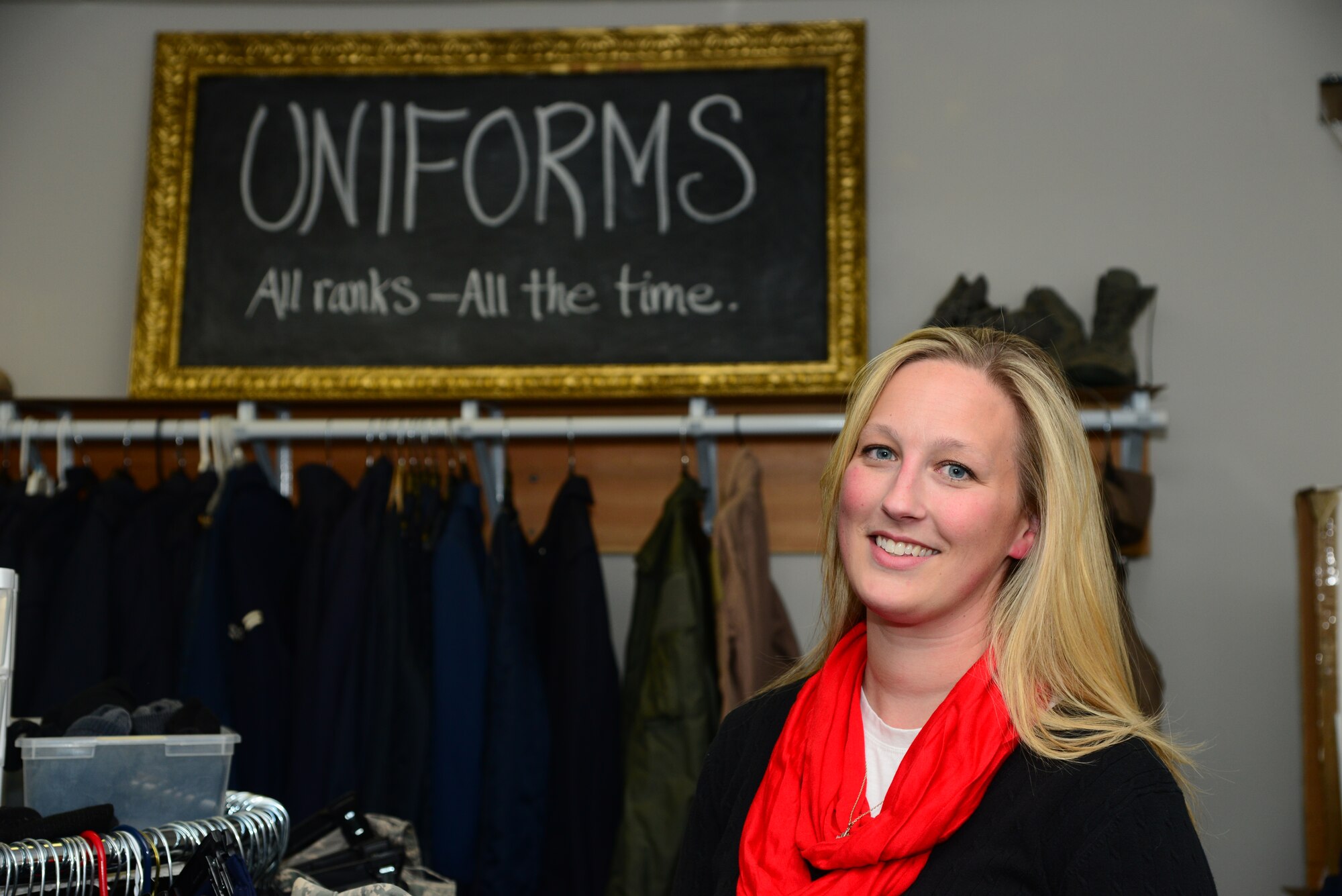 VANCE AIR FORCE BASE, Okla. -- Elaine McPherson, the Airman’s Attic liaison, stands in the uniform section of the Airman’s Attic Nov. 12. McPherson is the lead volunteer at the Airman’s Attic, which provides free clothes, kitchenware, childcare items and electronics for Airmen ranks E-1 through E-5. Officers are welcome to the Airman’s Attic as well, but they are limited to the uniform section. (U.S. Air Force photo/Senior Airman Frank Casciotta)  