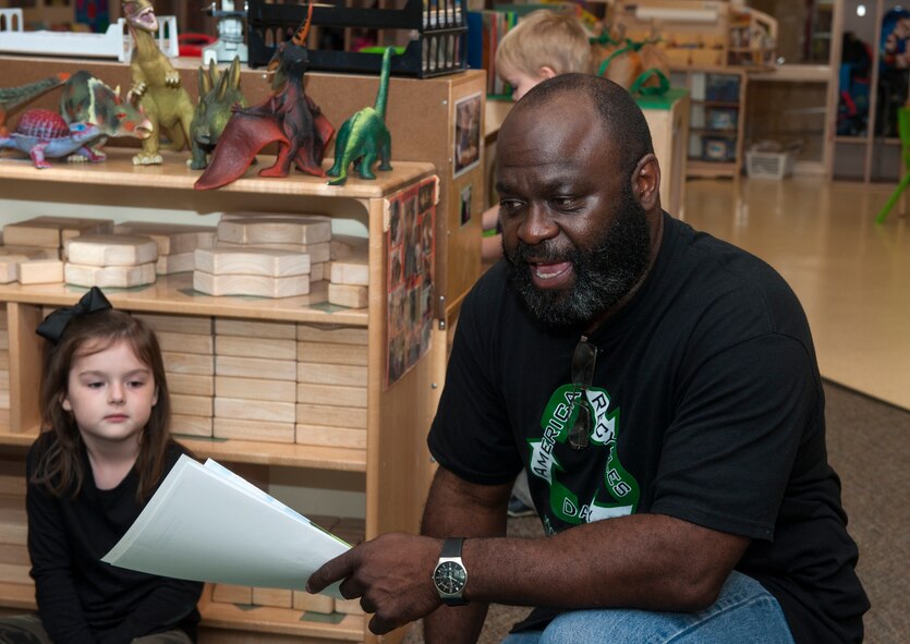 Elvis Lane, 23d Civil Engineer Squadron environmental specialist, speaks to children about recycling Nov. 13, 2014, at Moody Air Force Base, Ga. Lane visited the Child Development Center as part of events leading up to America Recycles Day Nov. 15. (U.S. Air Force photo by Senior Airman Jarrod Grammel/Released)
