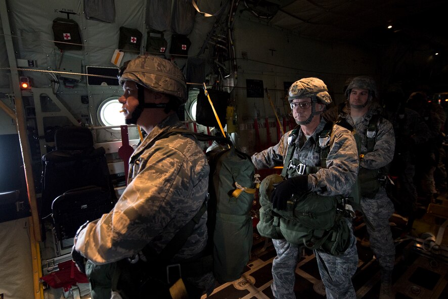 Airmen from the 820th Base Defense Group stand in a line before a static-line jump Nov. 13, 2014, over Moody Air Force Base, Ga. Jumpers exited the plane at 1,250 feet. (U.S. Air Force photo by Airman 1st Class Ryan Callaghan/Released)