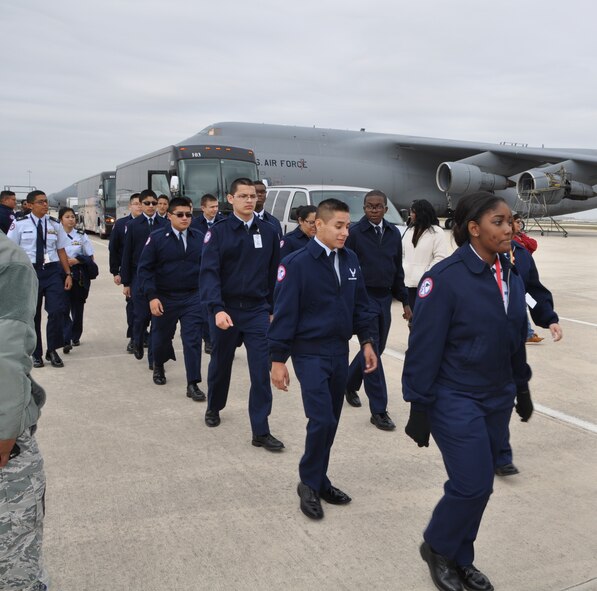 Air Force JROTC students from Cypress Springs High School, Cypress, Texas march in step on the, Nov. 14, 2014 just prior to a tour of a C-5A Galaxy Aircraft on Joint Base San Antonio- Lackland, Texas. The students were visiting the 433rd Airlift Wing and other agencies on JBSA-Lackland as part of their Community In Action class trip. (U.S. Air Force photo by Capt. Cris Medina)