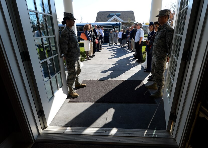The doors of the Fisher House at Dover Air Force Base, Del., are held open in preparation for a tour on Nov. 10, 2014. The Fisher House is used to accommodate family members who come to the base to witness the return of loved-ones killed-in-action overseas. (U.S. Air Force photo/Greg L. Davis) 