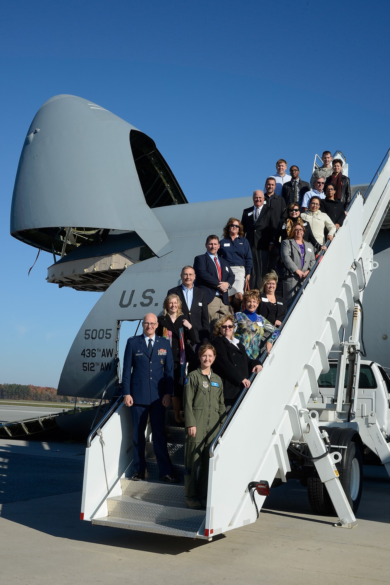 Attendees of the 2014 Military Construction (MILCON) Breakfast pose for a group before their tour of a C-5M aircraft on Nov. 10, 2014, at Dover Air Force Base, Del. The MILCON breakfast is a forum for updating community leaders on the military infrastructure and construction projects underway and planned for the future. (U.S. Air Force photo/Greg L. Davis) 