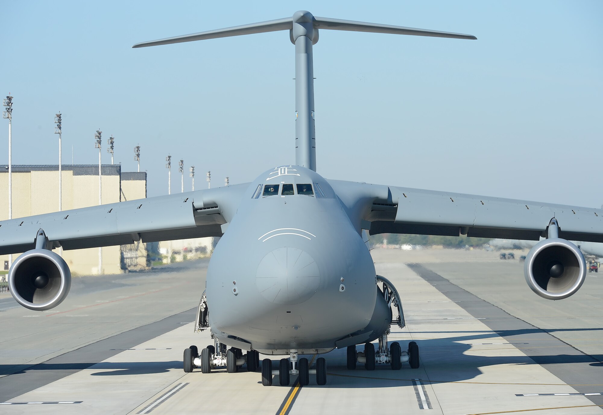 A C-5M Super Galaxy of the 436th Airlift Wing/512th Airlift Wing, (Air Force Reserve Command), taxis on the Dover Air Force Base, Del. parking ramp. The C-5M Super Galaxy is the modernized version of the long-serving C-5 Galaxy and has new, fuel efficient and more powerful engines, a glass cockpit, upgraded cargo compartment lighting in the form of low-current draw light emitting diode (LED) lights and strengthened engine nacelles. (U.S. Air Force photo/Greg L. Davis)   