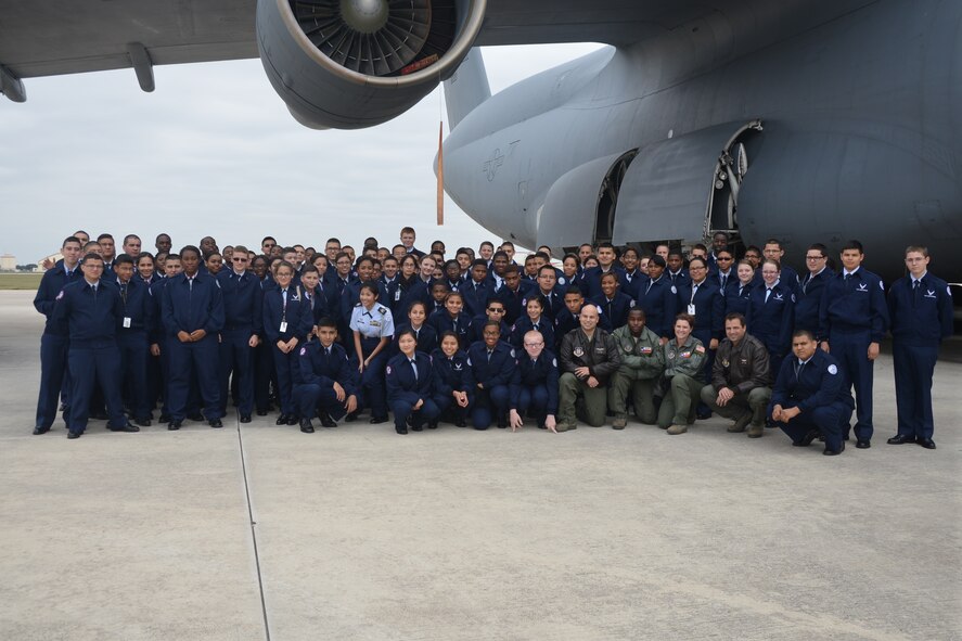 Air Force JROTC students from Cypress High School, Cypress, Texas near Houston and air crew personnel from the 68th Airlift Squadron pose for a group photo in front of a C-5A Galaxy, Nov. 14, 2014 at Joint Base San Antonio- Lackland, Texas. The students were visiting JBSA-Lackland as part of their Community In Action class trip. (U.S. Air Force photo by Minnie Jones)