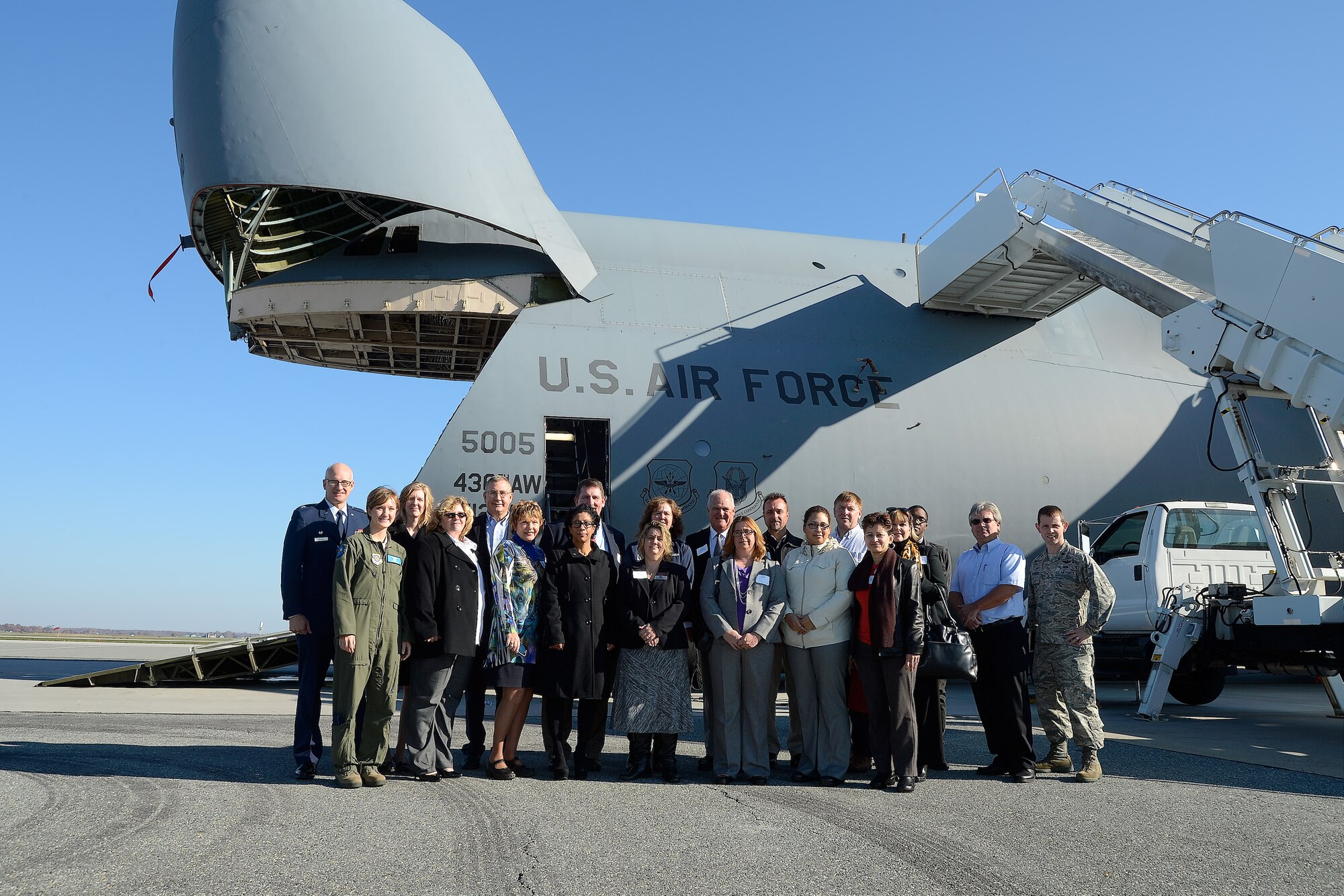 Attendees of the 2014 Military Construction (MILCON) Breakfast pose for a group photo before their tour of a C-5M aircraft on Nov. 10, 2014, at Dover Air Force Base, Del. The MILCON breakfast is a forum for updating community leaders on the military infrastructure and construction projects underway and planned for the future. (U.S. Air Force photo/Greg L. Davis)