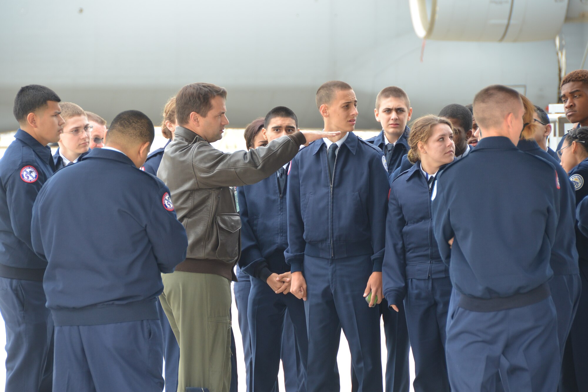 Maj. Lance Vivion (center) a pilot, 68th Airlift Squadron, Joint Base San Antonio-Lackland talks with Air Force JROTC students, Nov. 14, 2014 just prior to a tour on a C-5A Galaxy aircraft. The students from Cypress High School, Cypress, Texas near Houston, were visiting Joint Base San Antonio-Lackland as part of their Community In Action class trip. (U.S. Air Force photo by Minnie Jones)