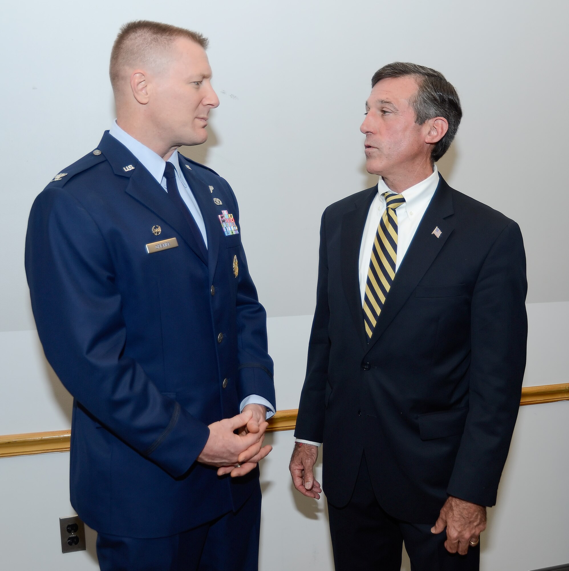 Col. Michael Grismer, 436th Airlift Wing commander speaks with Delaware Rep. John C. Carney Jr. about future military construction and improvement plans on Nov. 10, 2014, at Dover Air Force Base, Del. The Dover MILCON breakfast is a forum hosted by the Central Delaware Chamber of Commerce to provide information on Dover AFB???s infrastructure, construction projects underway and those planned for the future. (U.S. Air Force photo/Greg L. Davis)
