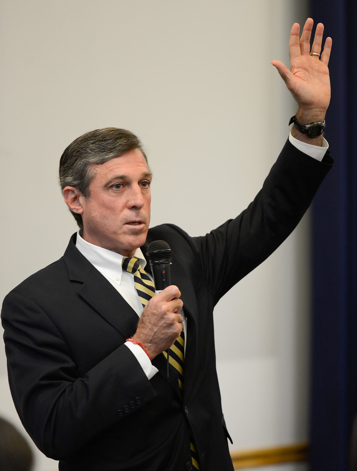 Rep. John C. Carney Jr. of Delaware asks for a show of hands while speaking to the audience of the 2014 Military Construction (MILCON) Breakfast on Nov. 10, 2014, at Dover Air Force Base, Del. Carney spoke about his support for the base and recognized its importance to the state. The Dover MILCON breakfast is a forum for updating community leaders on Dover AFB???s infrastructure, construction projects underway and those planned for the future. (U.S. Air Force photo/Greg L. Davis)