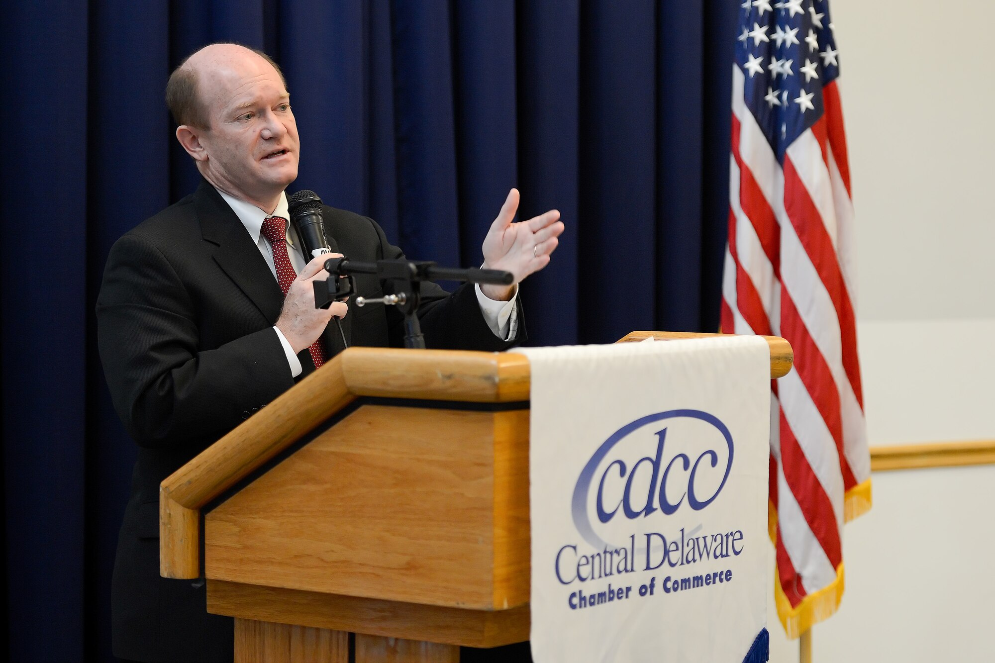 Sen. Chris Coons of Delaware speaks to the audience of the 2014 Military Construction (MILCON) Breakfast on Nov. 10, 2014, at Dover Air Force Base, Del. The Dover MILCON breakfast is a forum for updating community leaders on Dover AFB???s infrastructure, construction projects underway and those planned for the future. (U.S. Air Force photo/Greg L. Davis)
