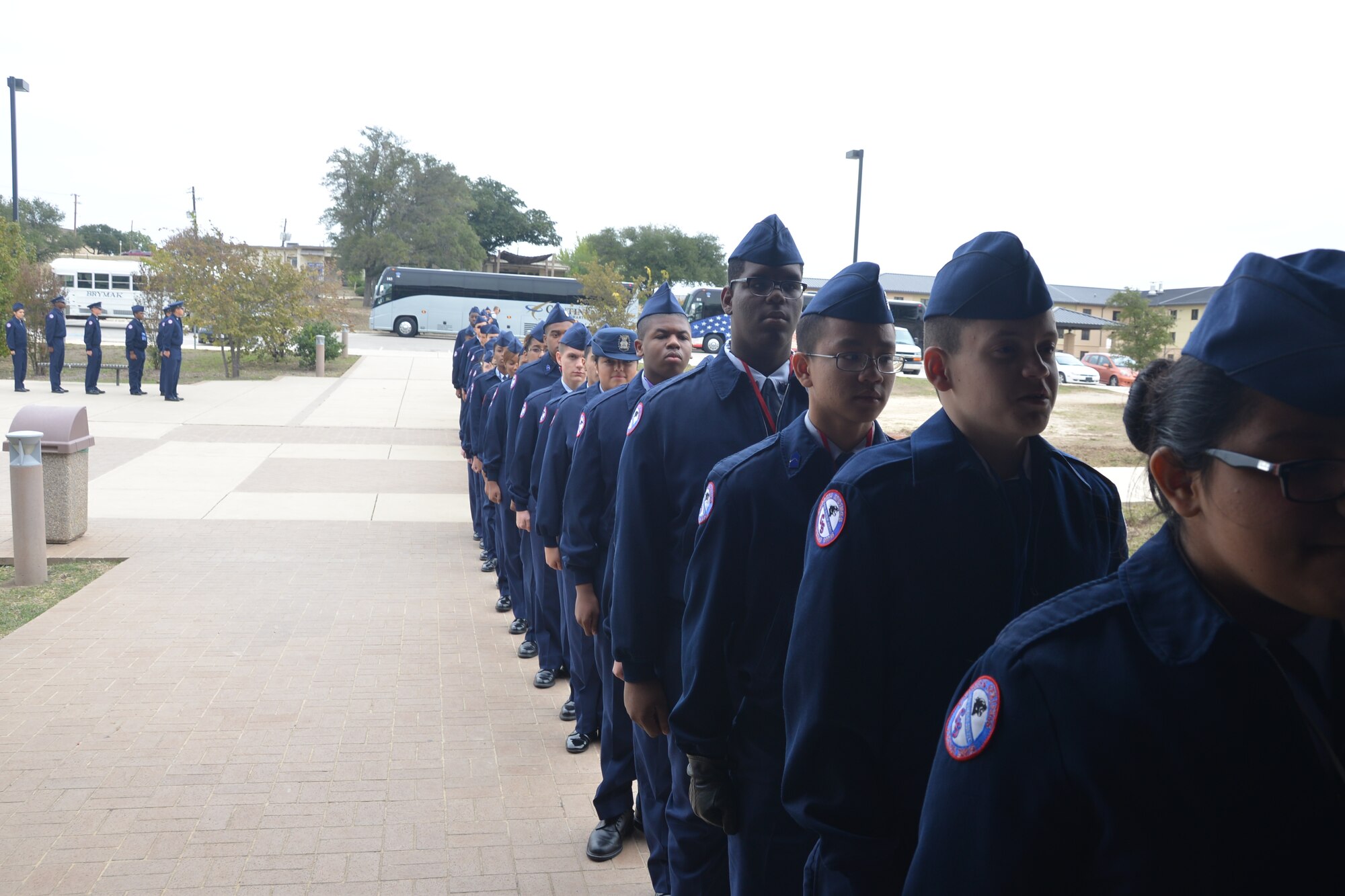 Air Force JROTC students from Cypress Springs High School, Cypress, Texas, cue up in front of the Lackland Training Annex Dining Facility, Nov. 14, 2014 at Joint Base San Antonio- Lackland, Texas. The students were visiting JBSA-Lackland as part of their Community In Action Class trip. (U.S. Air Force photo by Minnie Jones)