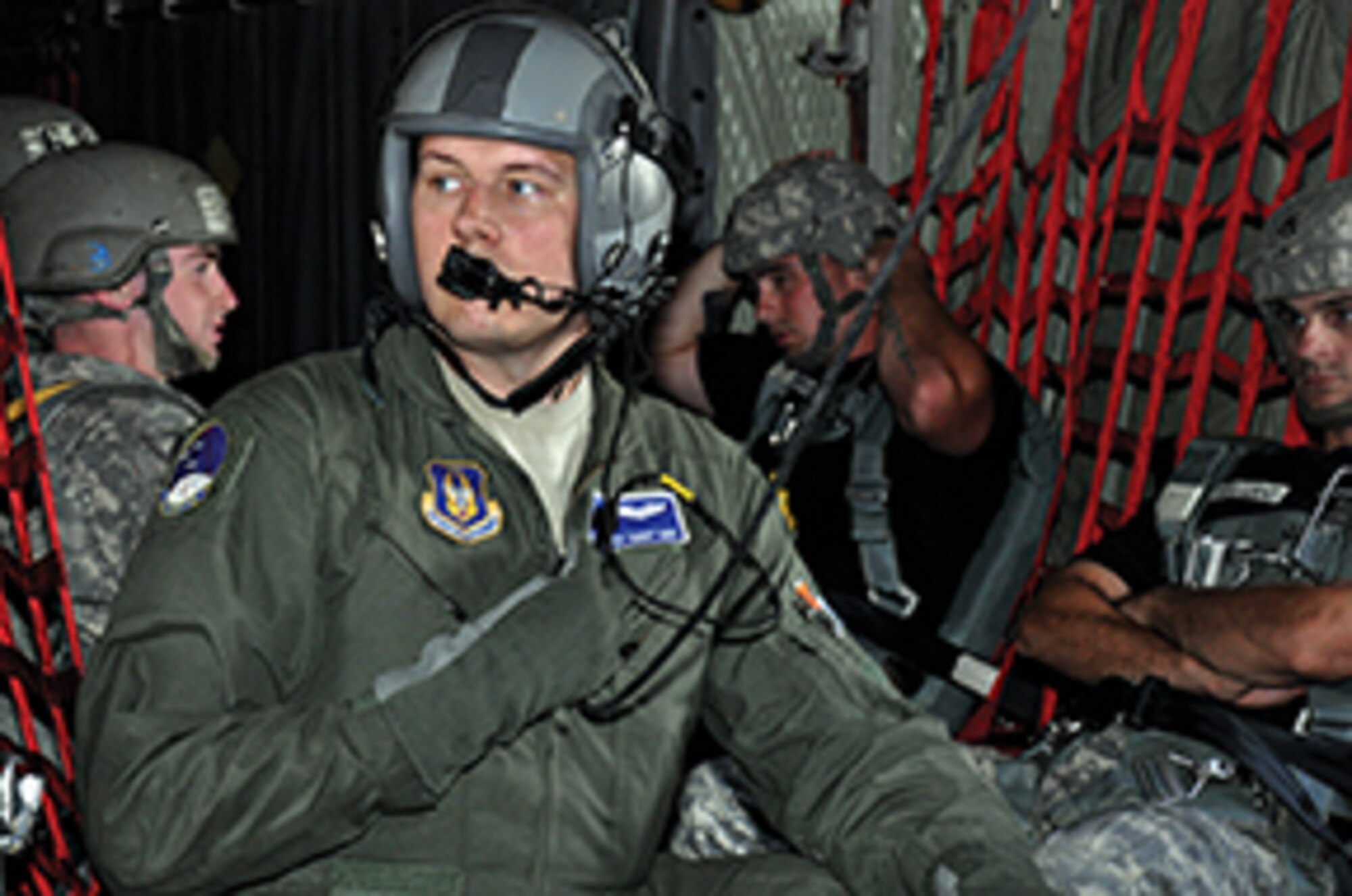 Staff Sgt. Ricky ‘Bobby’ Davis prepares to open the jump door as the C-130 approaches the drop zone.