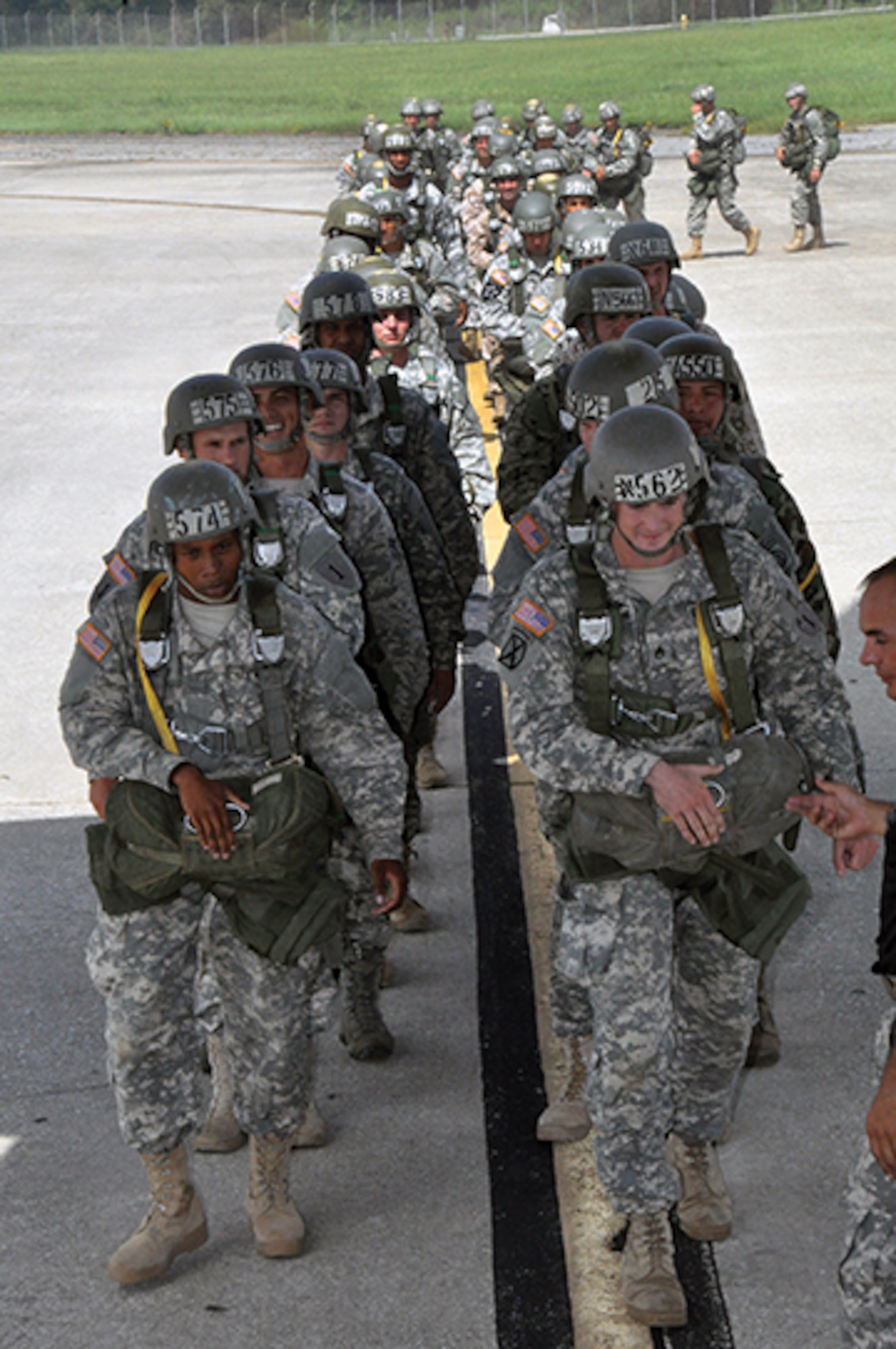 Airborne students make their way up the ramp into the C-130 prepared to begin their cycle of five jumps leading up to graduation.