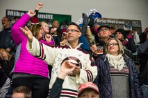 Senior Master Sgt. John Lium, 5th Aircraft Maintenance Squadron sortie support superintendent, watches a hockey game in Minot, N.D., Nov. 11, 2014. The teams let Lium drop the puck to honor him for his upcoming retirement and to thank him for his volunteer work with the team. (Courtesy photo) 