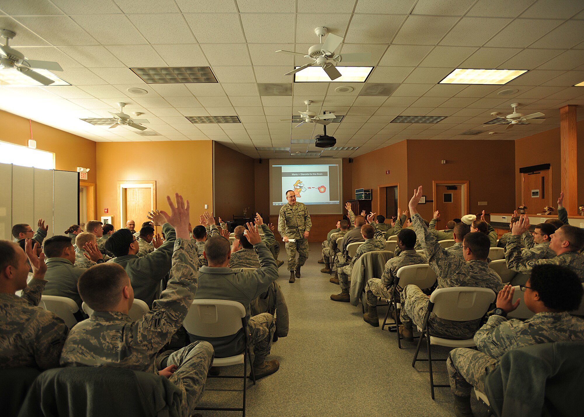 Chap. (Maj.) Darvin Winters Jr., 319th Air Base Wing head chaplain, asks a question about playing video games during his “Your Brian on Video Games” seminar during Wingman Day Nov. 13, 2014, on Grand Forks Air Force Base, N.D. A video was shown during the seminar that introduced cognitive researcher Daphne Bavelier explaining surprising news about video games. Members were able to attend three additional sessions and five different seminars that were non-faith and faith based seminars. (U.S. Air Force photo/Senior Airman Xavier Navarro)