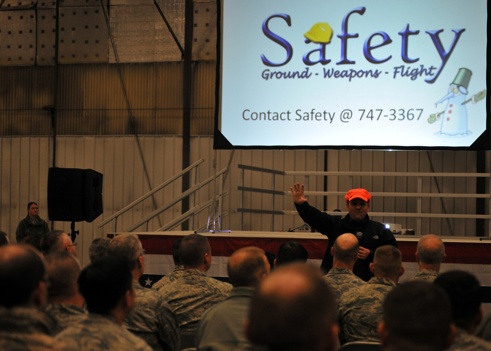 Andrew Swenson, 319th Air Base Wing ground safety manager, speaks about winter safety precautions and tips during a wing all call on Grand Forks Air Force Base, N.D., Nov. 13, 2014. Swenson spoke about speed being the number one factor in winter road related mishaps and stated how vehicle operators may not have control of what happened on the road, but do have control of what happens next. (U.S. Air Force photo/Senior Airman Xavier Navarro)