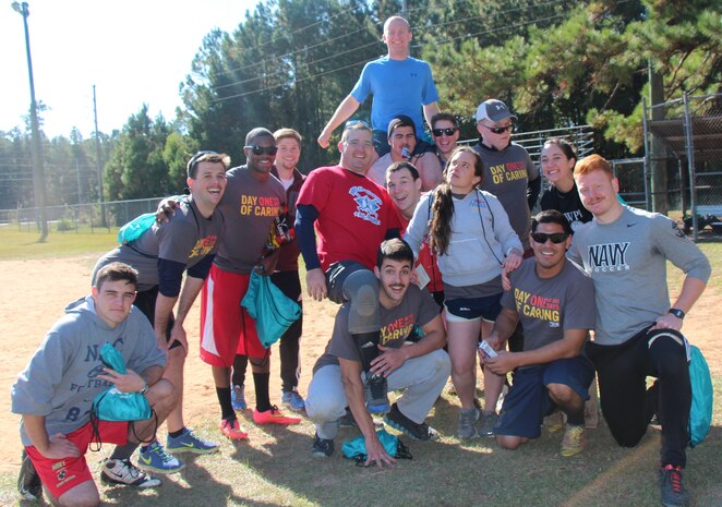 The Pitch Vibe team, made up of Naval Nuclear Power Training Command staff officers, took home the trophy at the 4th Annual Sexual Assault Prevention and Response Kickball Tournament Nov. 15, 2014, at Locklear Park on Joint Base Charleston, S.C. More than 20 teams participated in the event designed to raise awareness and promote efforts to prevent sexual assault. (U.S. Navy photo/Petty Officer 2nd Class Jason Pastrick)