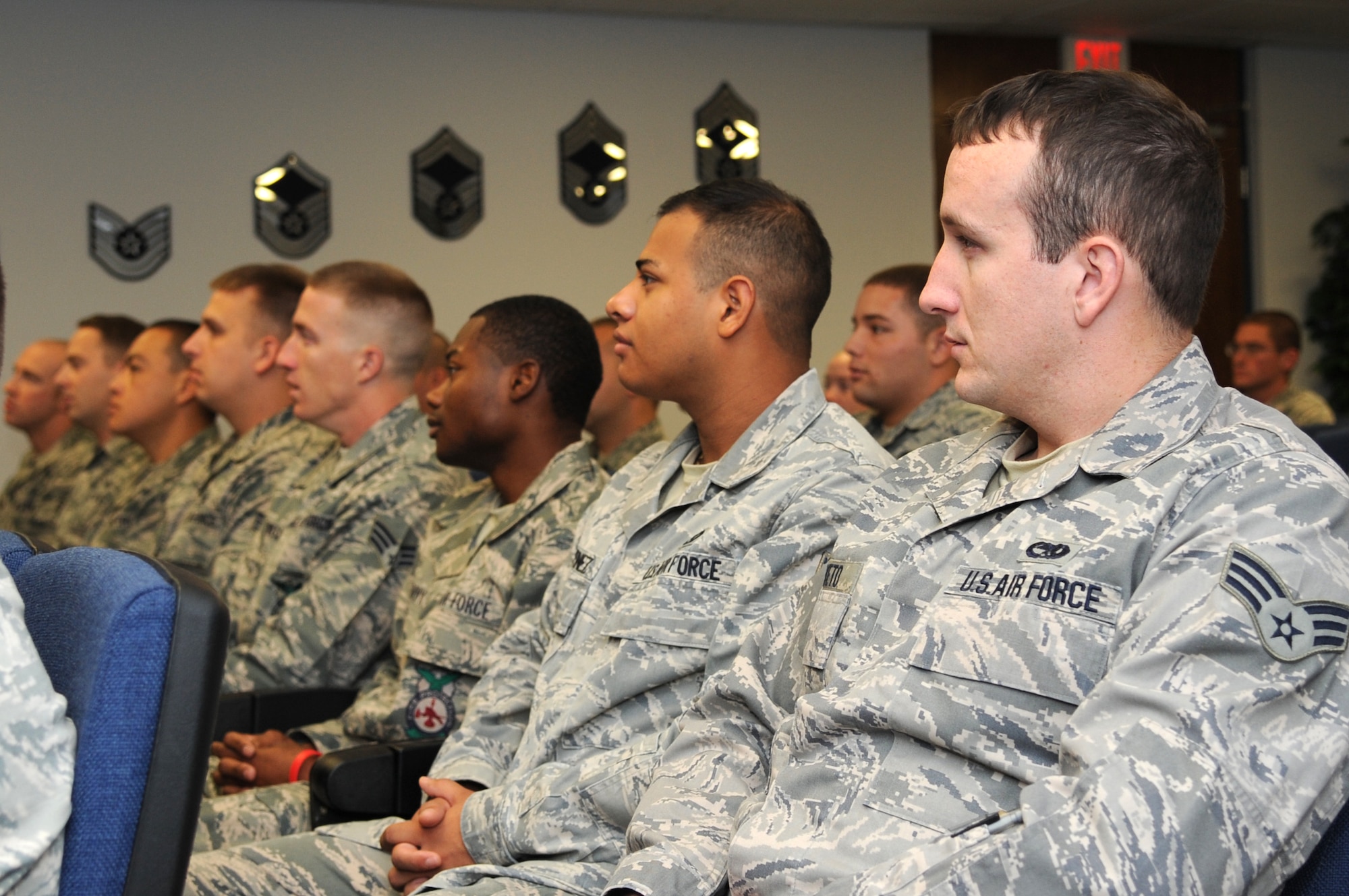 Students from the 4th Force Support Squadron Airman Leadership School listen to instructors introduce themselves at the beginning of their course at Seymour Johnson Air Force Base, North Carolina, Oct. 16, 2014. ALS covers topics including interpersonal communication and military dress and ceremony to prepare senior airmen and staff sergeants for their future roles as supervisors. (U.S. Air Force photo/Airman 1st Class Ashley J. Thum)