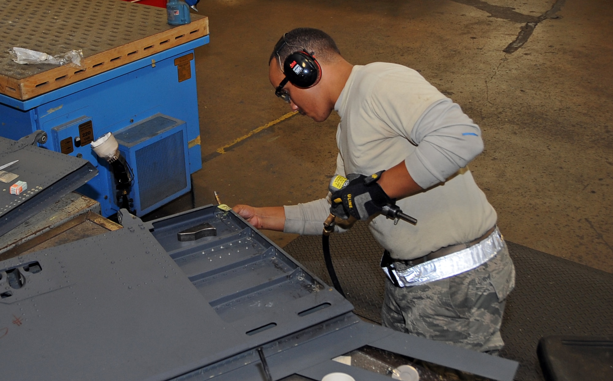 Staff Sgt. Montez Lee, 2nd Maintenance Squadron aircraft structural maintenance craftsman, reviews his work on a B-52H Stratofortress spoiler at Barksdale Air Force Base, La., Nov. 13, 2014. Airmen from the 2nd MXS aircraft structural maintenance shop repair or replace sheet metal and fix loose rivets and cracks on the B-52. (U.S. Air Force photo/Staff Sgt. Jason McCasland)