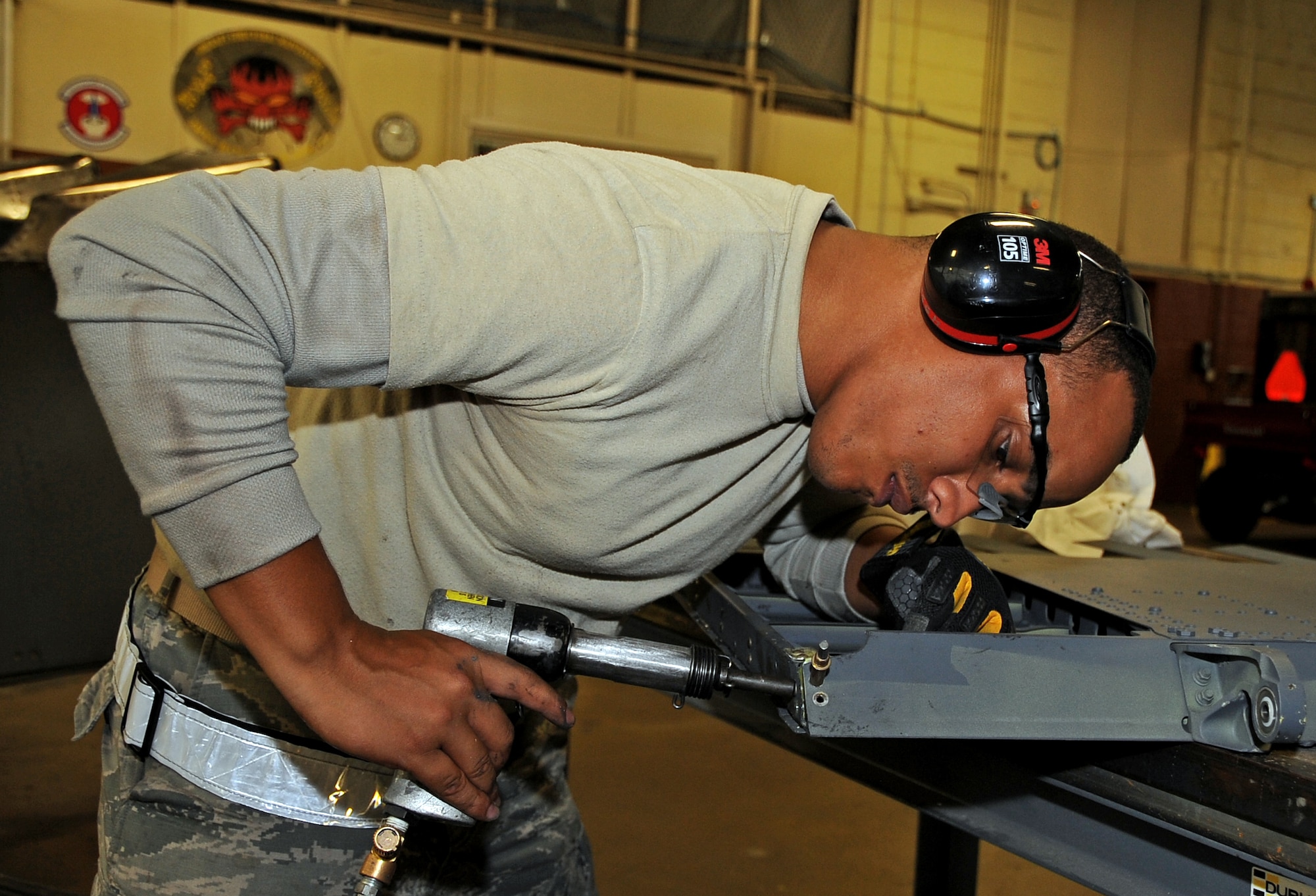 Staff Sgt. Montez Lee, 2nd Maintenance Squadron aircraft structural maintenance craftsman, drills a hole in preparation for a rivet at Barksdale Air Force Base, La., Nov. 13, 2014. Aircraft structures airmen are responsible for the skin of the B-52H Stratofortress, which includes paint, panel replacement and structural rib repairs. (U.S. Air Force photo/Staff Sgt. Jason McCasland)