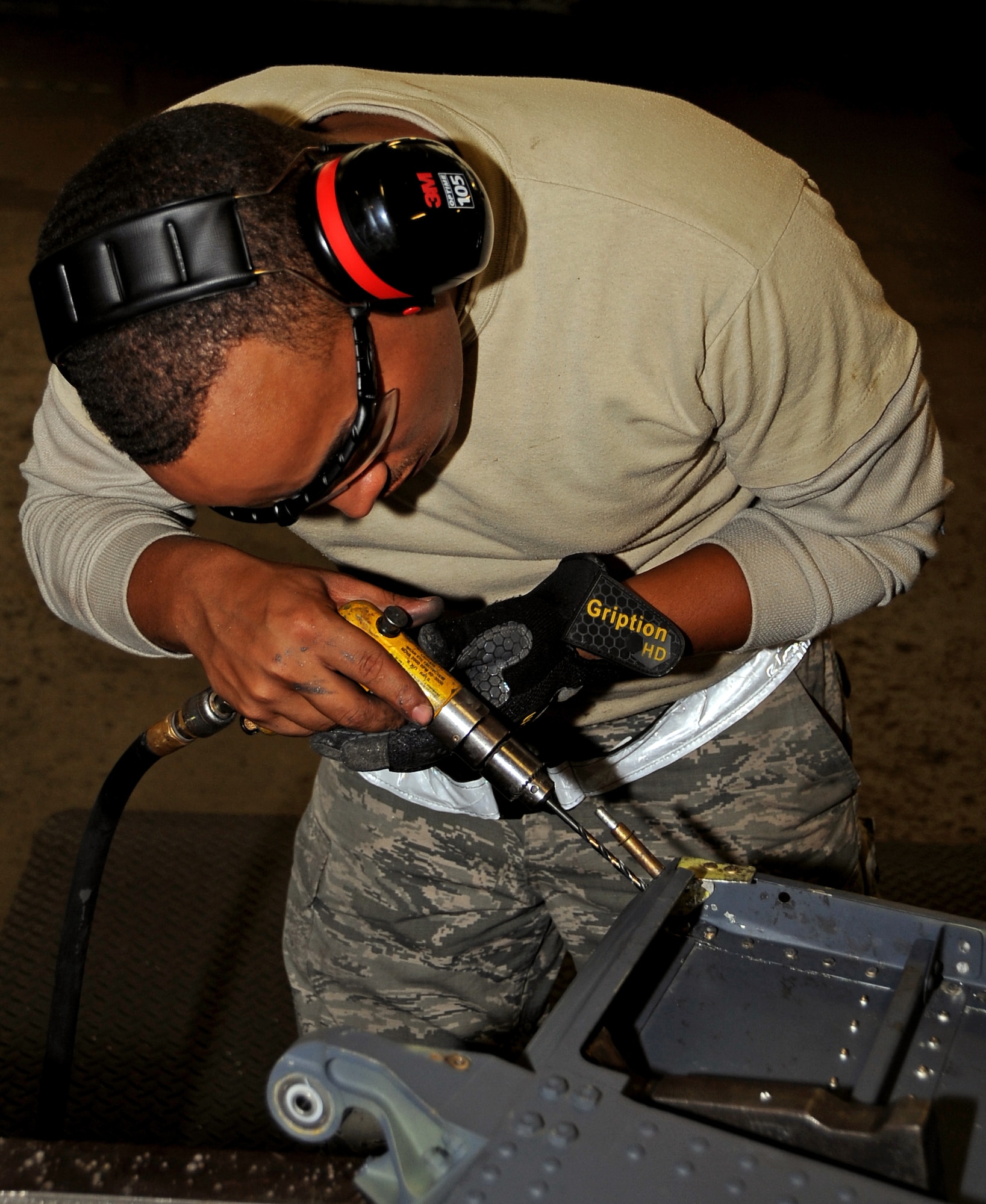 Staff Sgt. Montez Lee, 2nd Maintenance Squadron aircraft structural maintenance craftsman, drills a hole in preparation for a rivet at Barksdale Air Force Base, La., Nov. 13, 2014. Aircraft structures airmen are responsible for the skin of the B-52H Stratofortress, which includes paint, panel replacement and structural rib repairs. (U.S. Air Force photo/Staff Sgt. Jason McCasland)