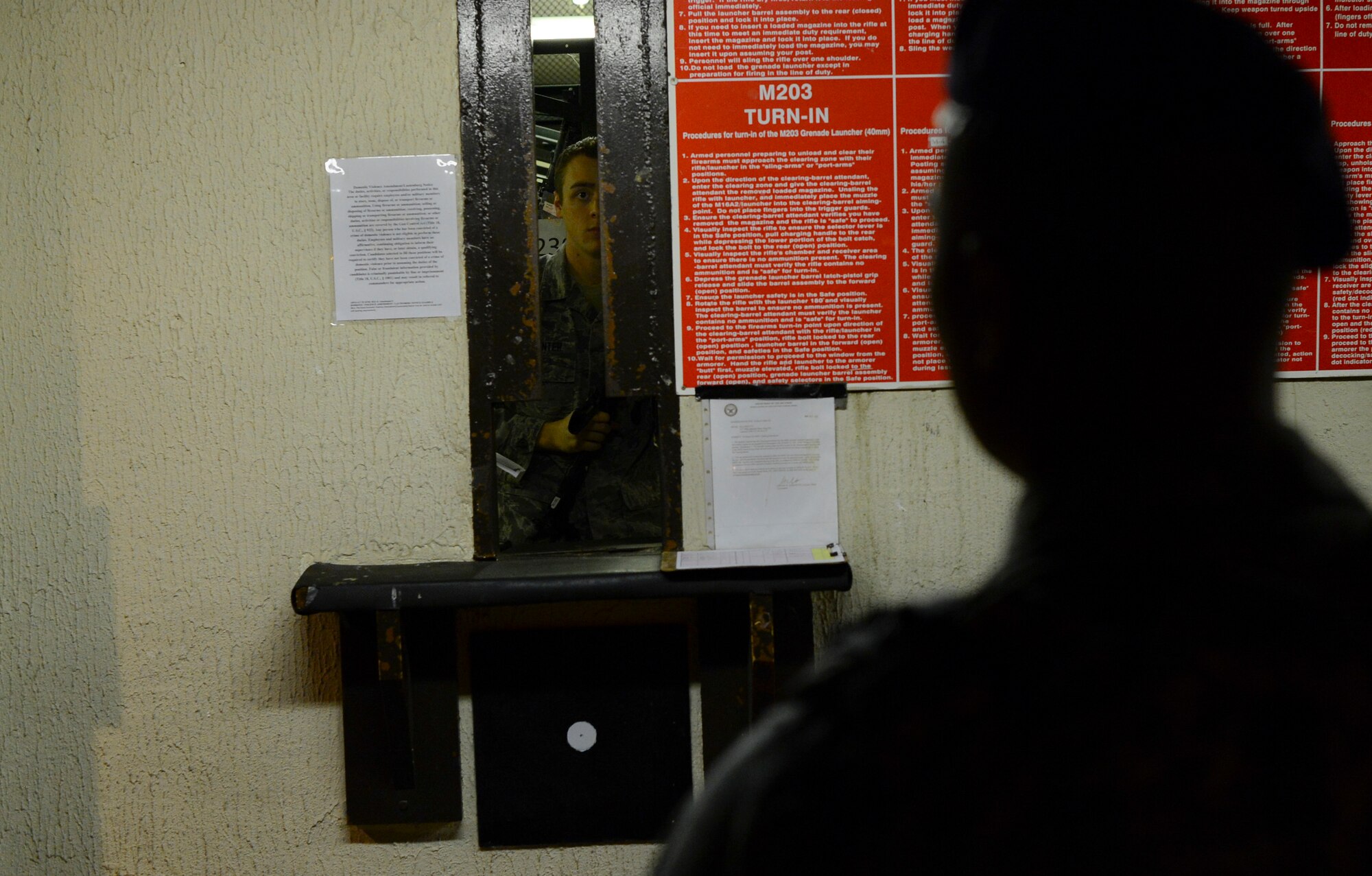 An Airman assigned to the 48th Security Forces Squadron waits to approach the armory to receive the required weapons for his shift at Royal Air Force Lakenheath, England, Nov. 12, 2014. In 1961, the squadron earned it’s first of 19 Air Force Outstanding Unit Awards, including honors earned from their 48th Expeditionary Security Forces Squadron actions in Operation Noble Anvil; the air war over Serbia in which the 48th Fighter Wing deployed 1,011 personnel to 18 different locations. (U.S. Air Force photo by Senior Airman Erin O’Shea/Released)