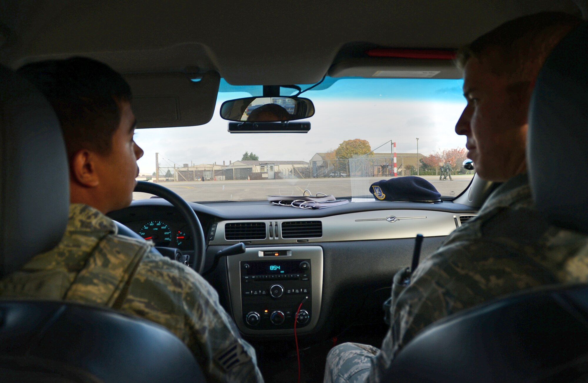 Senior Airman Manuel Garcia and Airman 1st Class Zachary Warden, both 48th Security Forces Squadron members, patrol the flightline during their shift at Royal Air Force Lakenheath, England, Nov. 12, 2014. Security forces follow procedural checklists while they patrol sensitive areas of the base and ensure 48th Fighter Wing assets are protected at all times. Garcia is a response force leader and Warden is a response force member. (U.S. Air Force photo by Senior Airman Erin O’Shea/Released) 