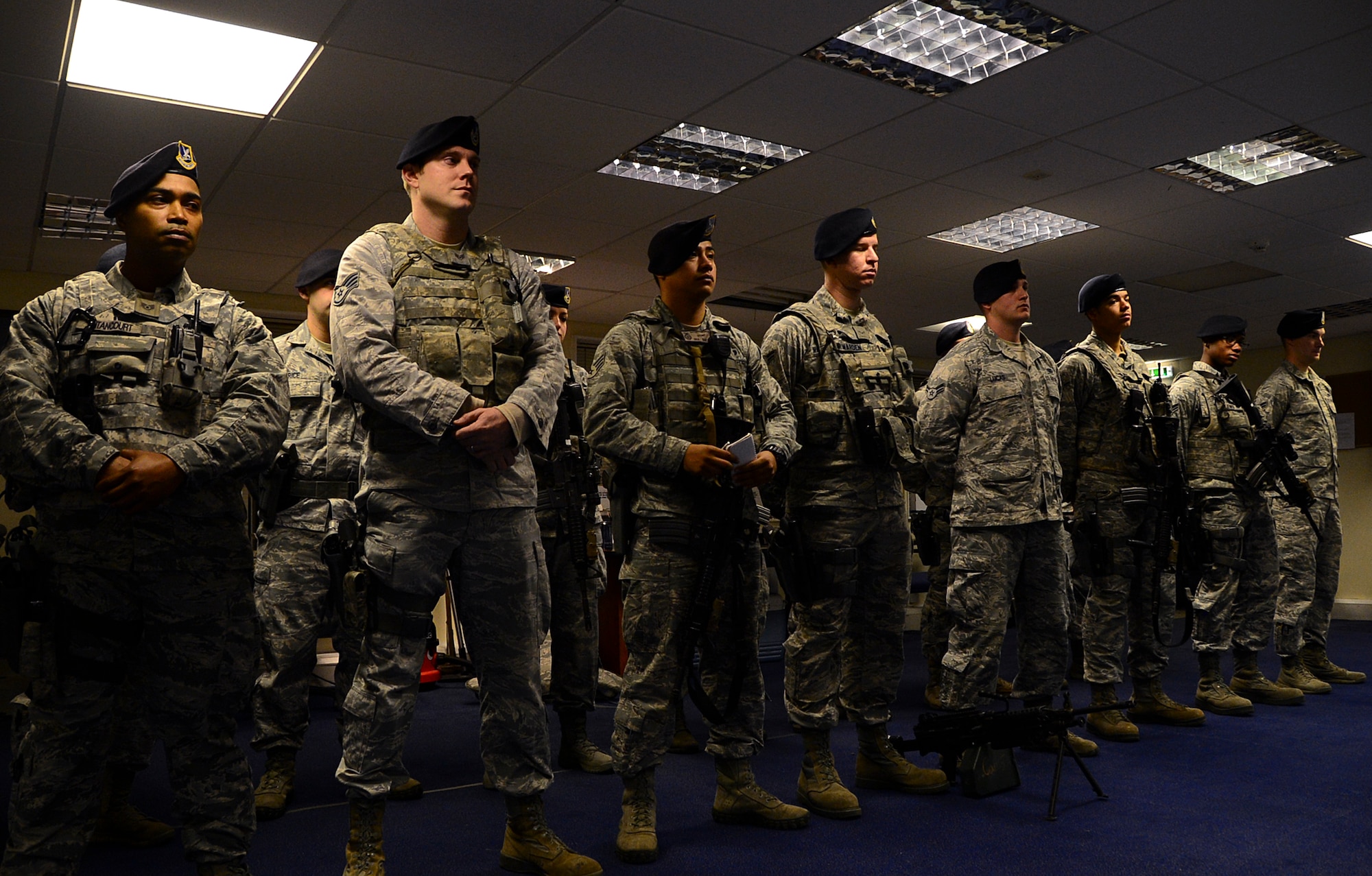 Members of the 48th Security Forces Squadron attend a briefing before beginning their shift at Royal Air Force Lakenheath, England, Nov. 12, 2014. During this briefing, security forces members alternate from day shifts to mid-shifts and are updated on current base operations before assuming security responsibilities. Members do this every day, at every shift change. (U.S. Air Force photo by Senior Airman Erin O’Shea/Released)