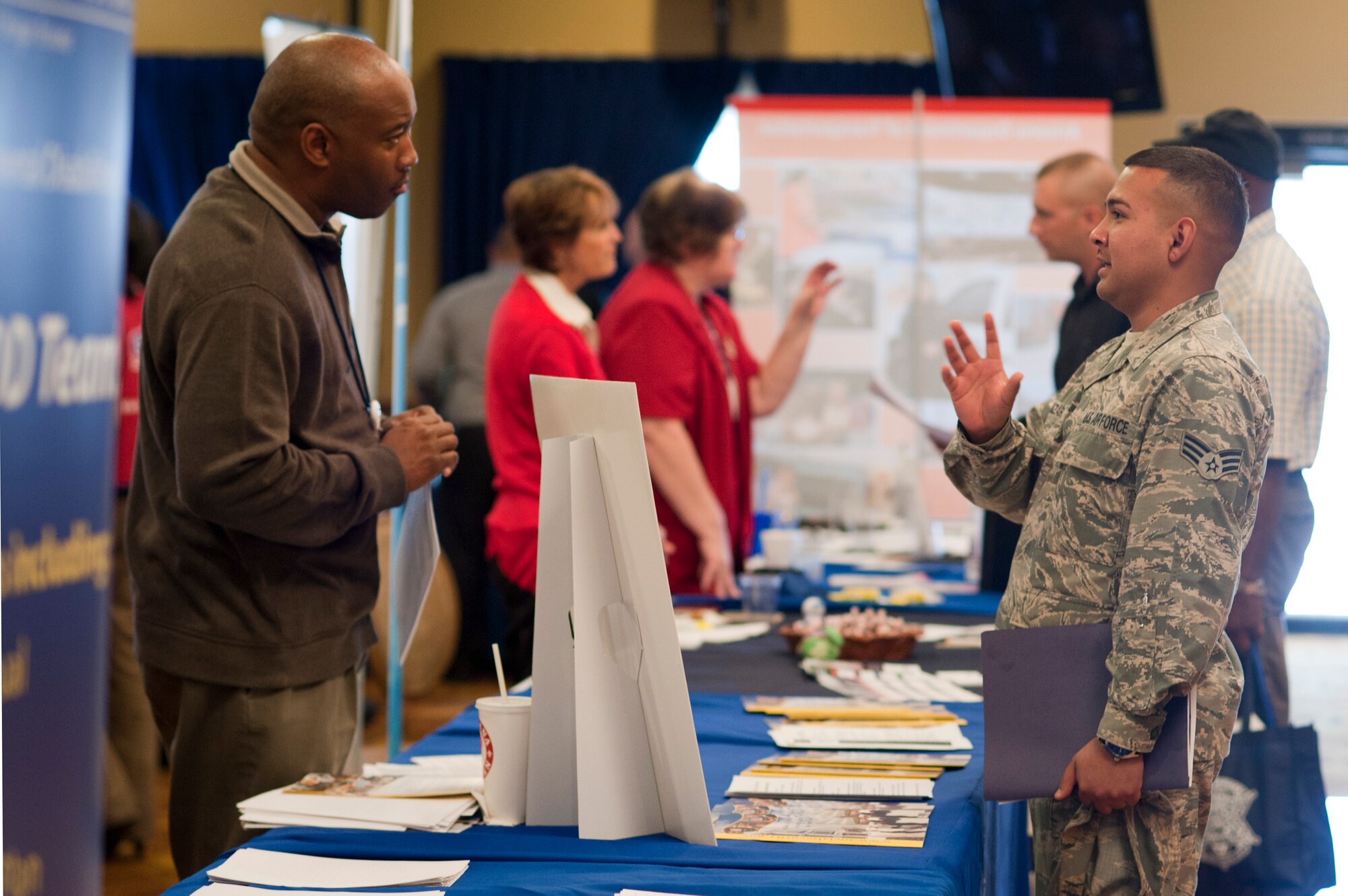 Senior Airman Armando Salazar, 944th Fighter Wing, walks around to various business representatives during the fall job fair Nov. 5 at Club Five Six on Luke Air Force Base. More than 200 active-duty service members, dependents and retirees signed up for the fair. (U.S. Air Force photo/Staff Sgt. Staci Miller)