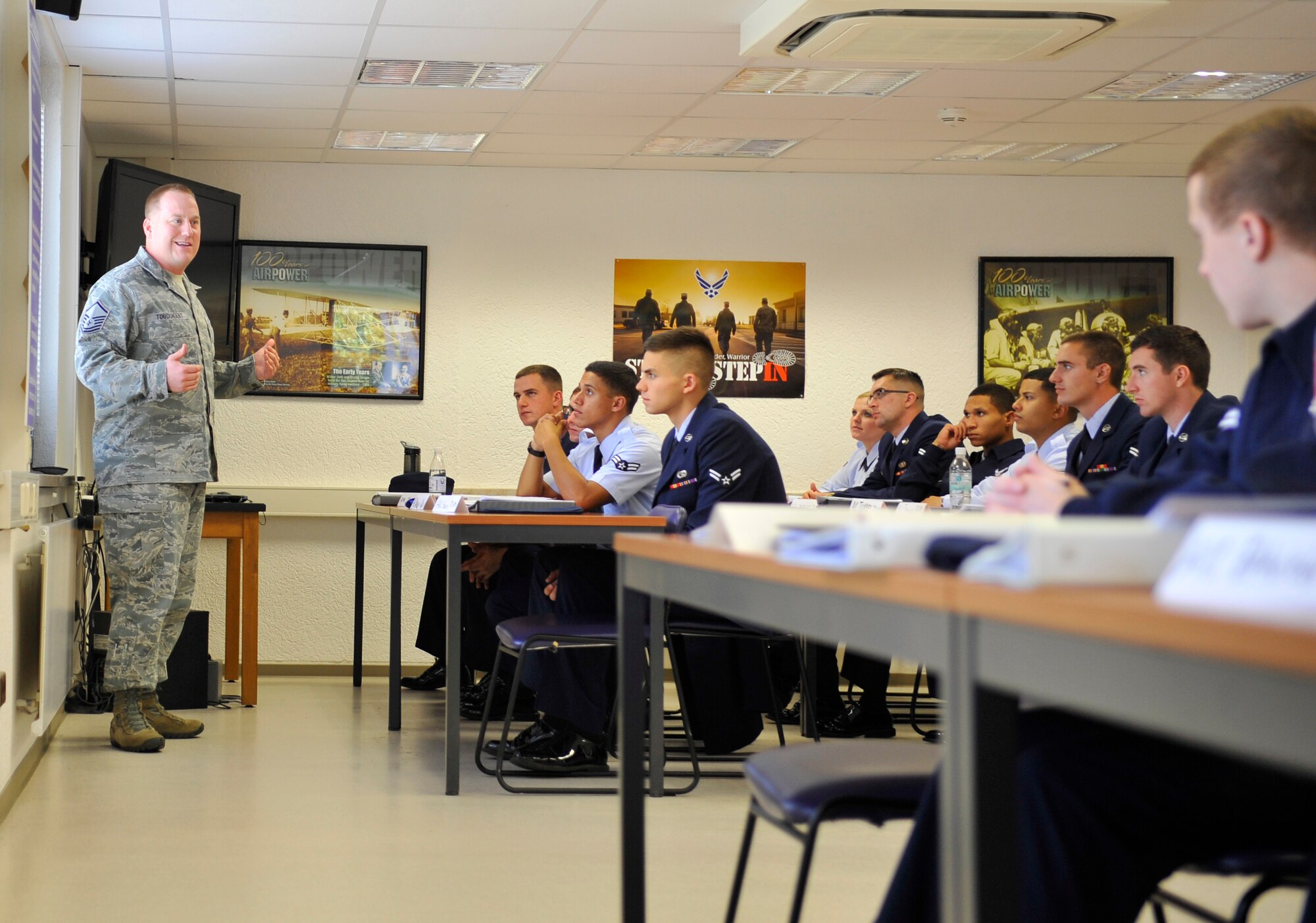 Master Sgt. Etienne Tousignant, 86th Force Support Squadron career assistance advisor, talks to the first-term airmen in the first-term airmen center Sept. 23, 2014 at Ramstein Air Base, Germany. Tousignant talks to the airmen about the importance of their jobs and the impact they have on the Air Force Mission. The CAAs offer many forums and assistance from retraining to transitioning into civilian life. (U.S. Air Force Photo/Airman Larissa Greatwood)