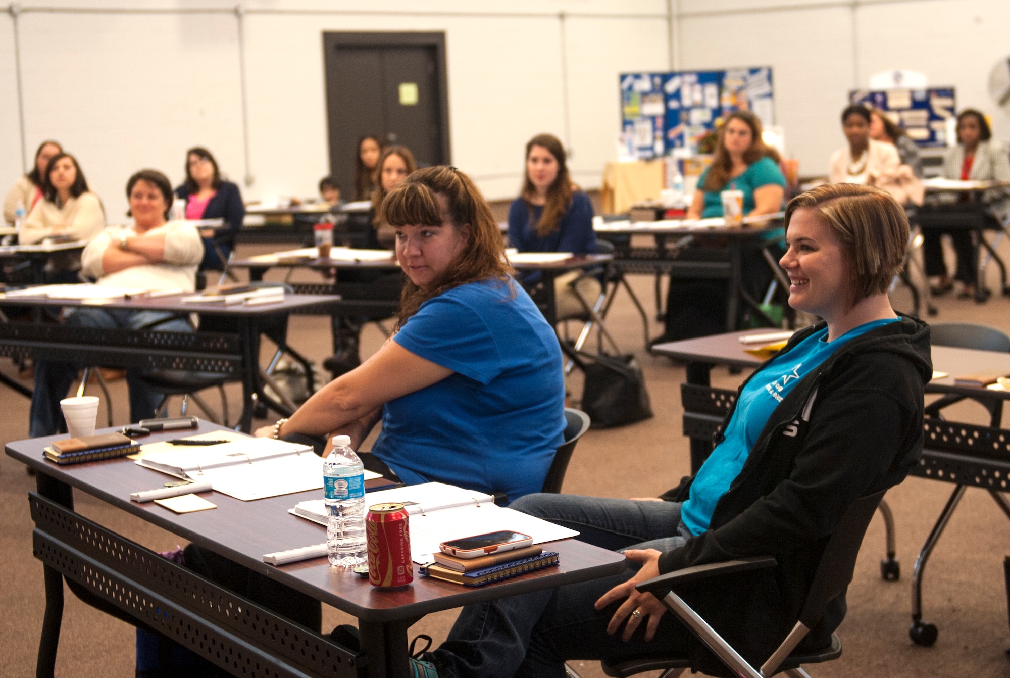 Amber Seigler, right, wife of U.S. Air Force Staff Sgt. Joseph Seigler, 71st Rescue Squadron, introduces herself during the Specialized Training of Military Parents (STOMP) workshop Nov. 13, 2014, at Moody Air Force Base, Ga. STOMP was a two-day workshop on various topics to help meet the needs of the military community such as: individualized education programs, guardianship, supplemental security income and enhanced care health option. (U.S. Air Force photo by Senior Airman Olivia Bumpers/Released)