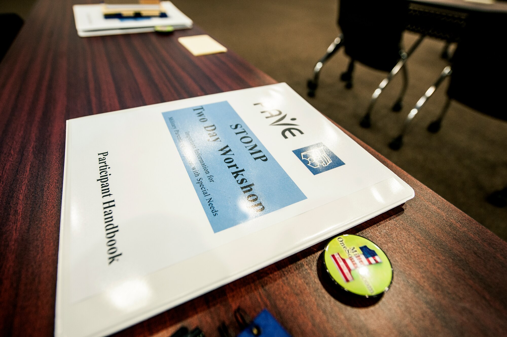 A binder rests on a desk before the Specialized Training of Military Parents (STOMP) workshop begins Nov. 13, 2014, at Moody Air Force Base, Ga. The workshop provided military families with information and techniques for raising a child with special needs. (U.S. Air Force photo by Senior Airman Olivia Bumpers/Released)