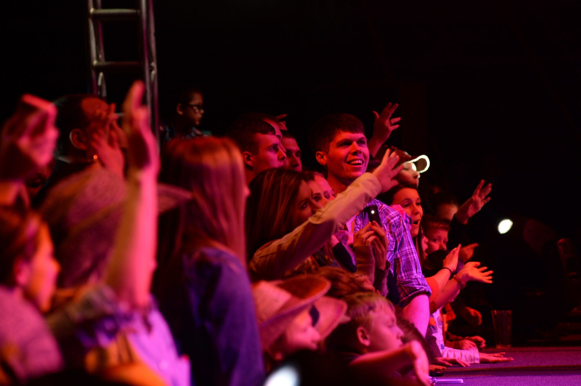 Members of the Spangdahlem community watch country music artist Darius Rucker perform during a concert Nov. 14, 2014, at Hangar One at Spangdahlem Air Base, Germany. Rucker sang for military members and families during his Europeantour. (U.S. Air Force photo by Airman 1st Class Dylan Nuckolls/Released)