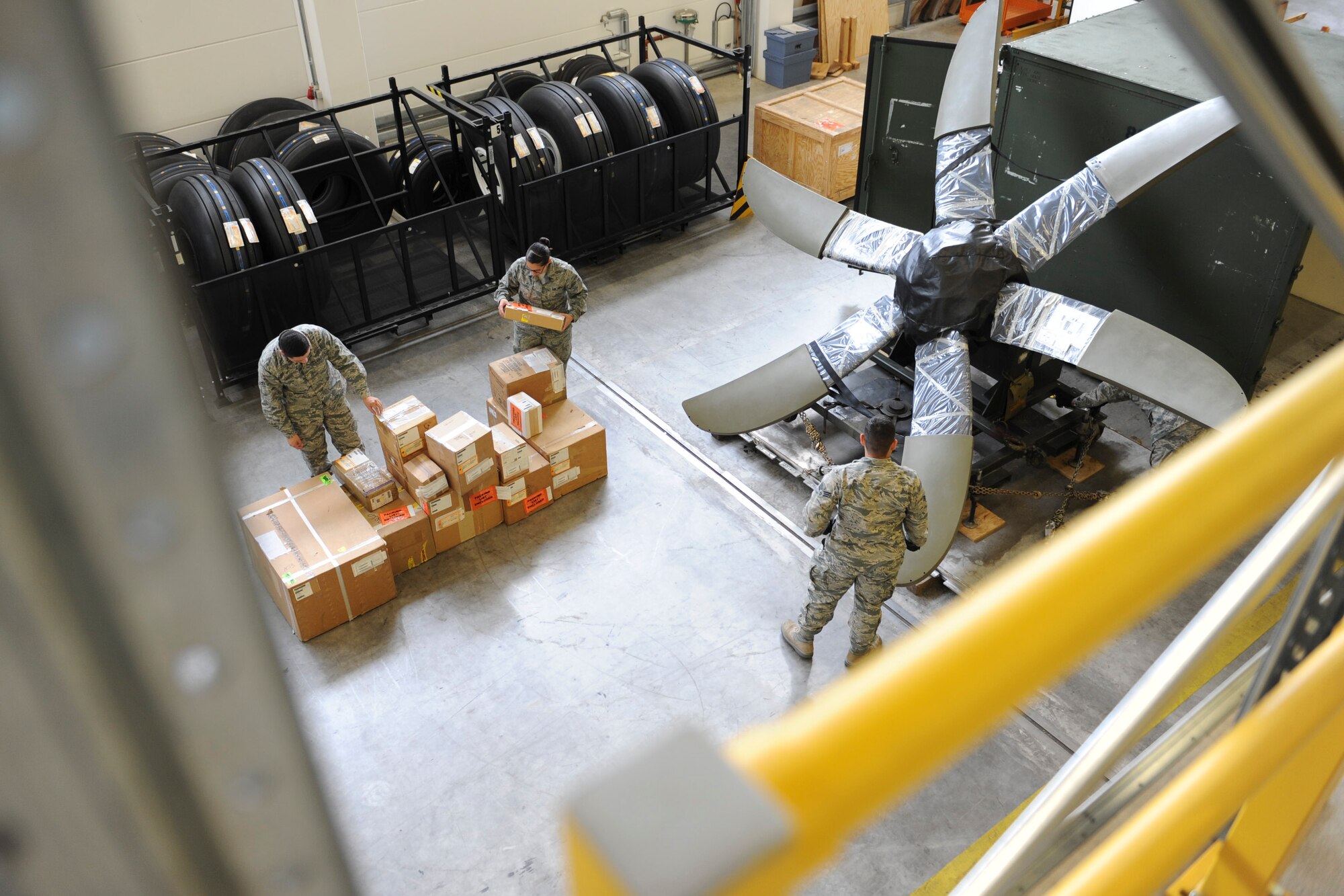 Supply journeymen from the 86th Logistics Readiness Squadron sort out equipment and prepare for a contingency tasking on Ramstein Air Base, Germany, Sep. 24, 2014. To get ready for a contingency tasking, the 86th LRS pulls aircraft parts from a warehouse, stage it, conduct inventory and then get it ready for missions. (U.S. Air Force photo/Airman 1st Class Michael Stuart) 