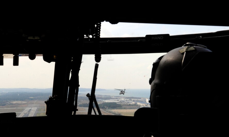 U.S. Air Force Capt. Andrew Fink, assigned to the 33rd Rescue Squadron, pilots a U.S. Air Force HH-60G Pave Hawk helicopter into position during an approach over Komatsu Air Base, Japan, during Exercise Keen Sword 2015 Nov.12, 2014. The team was returning from a successful joint training mission with the Japan Air Self Defense Force Komatsu Air Rescue Squadron where USAF and JASDF pararescuemen successfully extracted a simulated drowning victim. The 33rd RQS is assigned to Kadena Air Base, Japan. (U.S. Air Force photo by 2nd Lt. Erik Anthony/Released) 