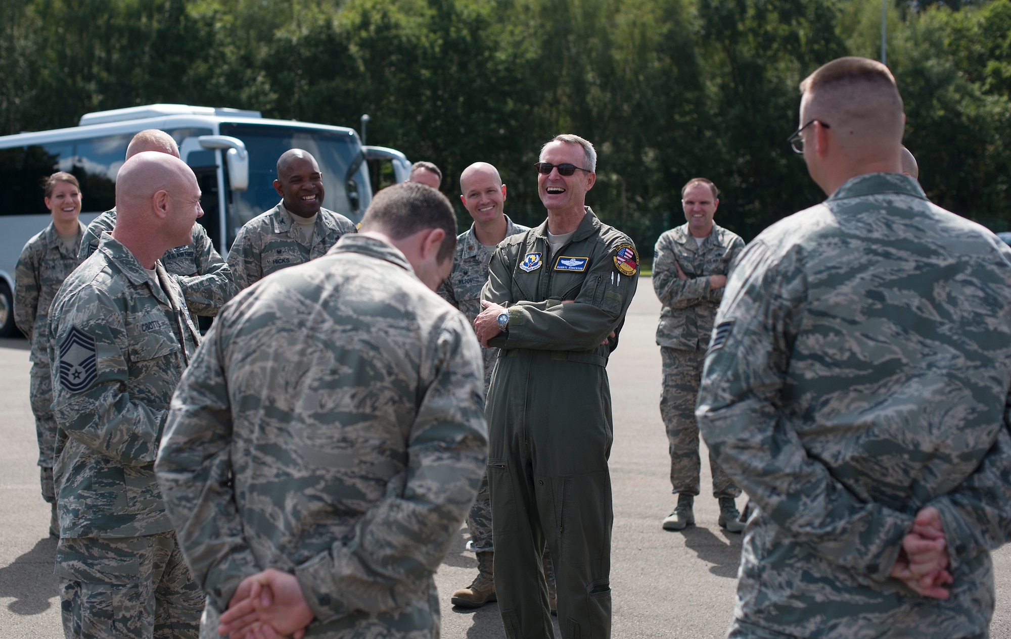 Lieutenant Gen. Darryl Roberson, 3rd Air Force commander, enjoys a laugh with members of the 86th Munitions Squadron during an immersion with the 86th Airlift Wing on Ramstein Air Base, Germany Aug. 28, 2014. Roberson recently took command of the 3rd Air Force and visits such as these allow him to see firsthand Ramstein’s impact on the Air Force mission. He also spoke with Airmen from throughout the 86th AW and learned how their day-to-day jobs impact the mission. (U.S. Air Force photo/Senior Airman Damon Kasberg)